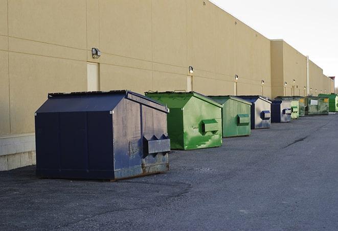 a large dumpster serves as a temporary waste container on a job site in Bell Gardens